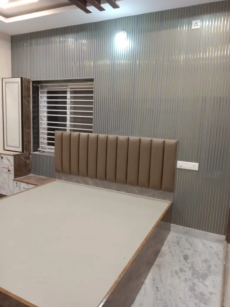 Private residence bedroom with panelled headboard wall